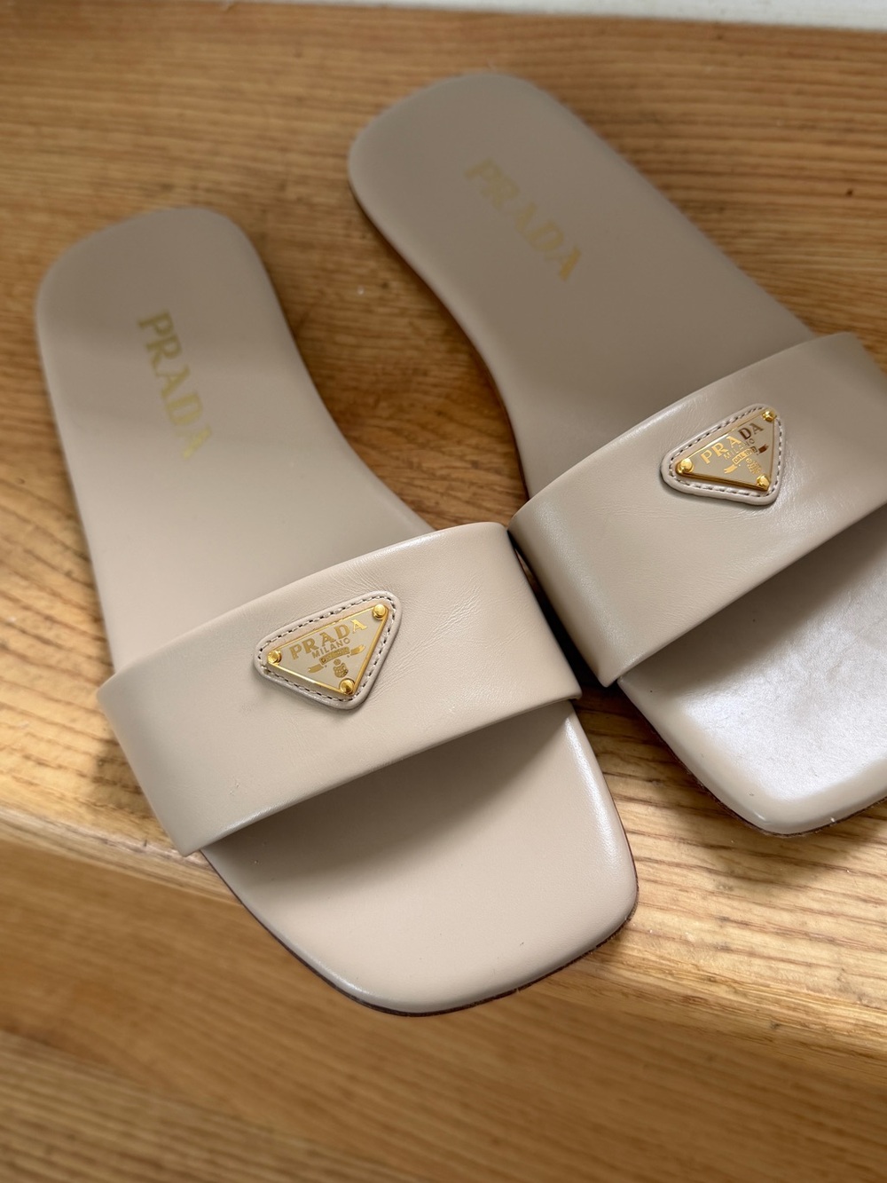 Prada Neutral Beige Leather Slide Sandals with Gold Triangle Logo
